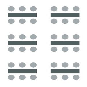 Rows of tables with chairs on either side.