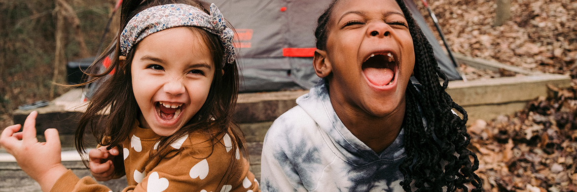 Two young girls smiling