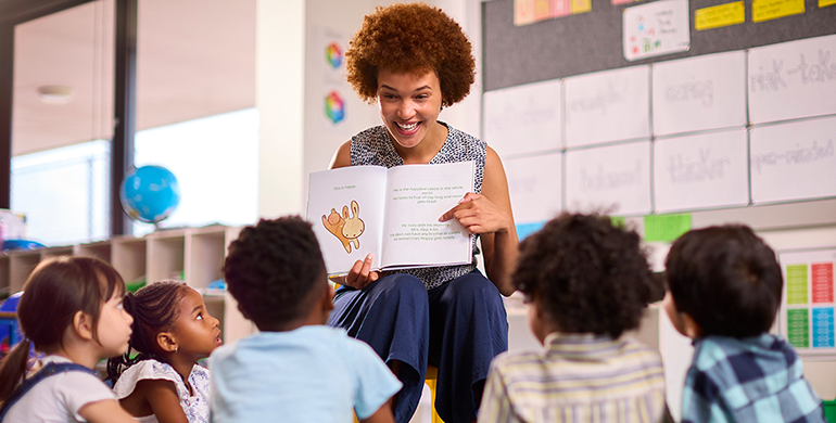 Woman reading to a group of children