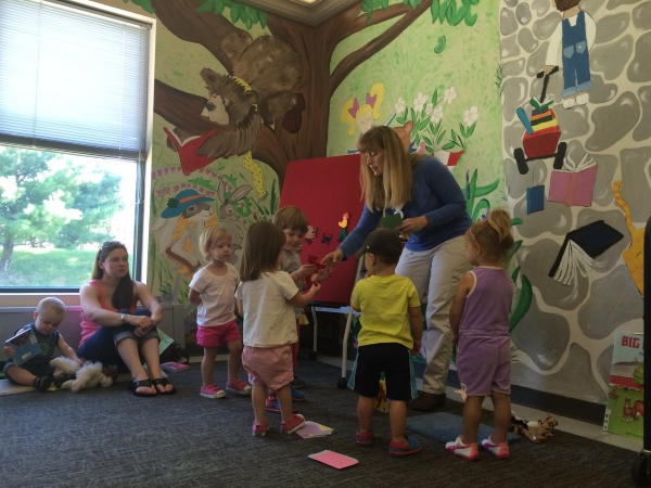 Children putting items on flannel board
