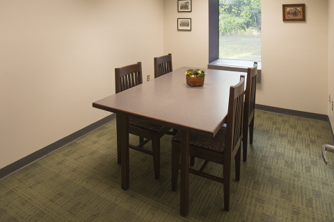 Baldwin Room interior with desk and four chairs