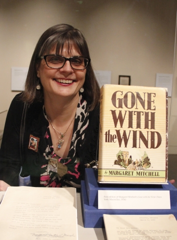 Kathleen Marcaccio with the book, Gone with the Wind by Margaret Mitchell