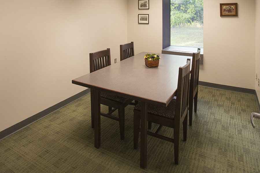 Baldwin Room interior with desk and four chairs