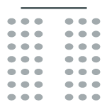 Room arranged with rows of chair with central aisle facing screen at front of room.